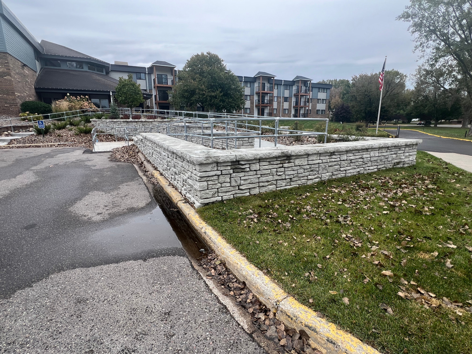 Finished retaining wall in a commercial landscaped setting